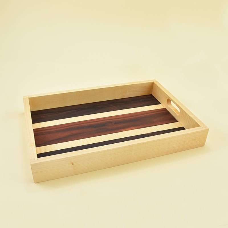 Wooden tray/Lesen pladenj Wooden tray made of maple wood and veneers of ziricote, maple and rosewood/Lesen pladenj, narejen iz javorjovega lesa in furnirjev zirikote, javorja in palisandra
